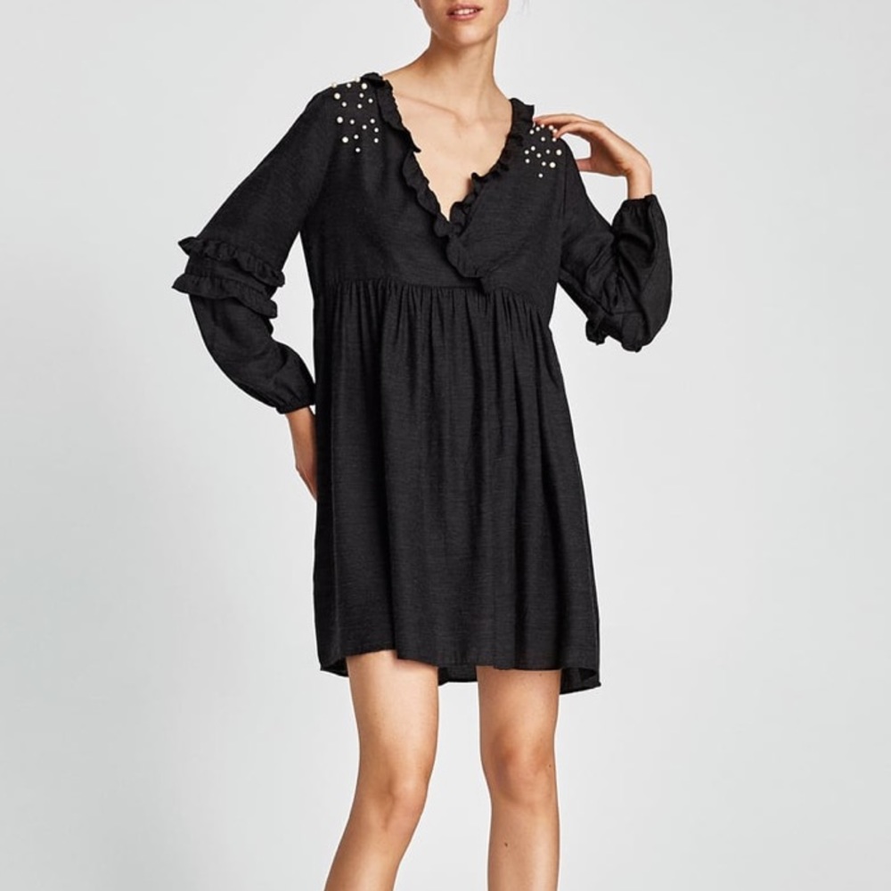 DRESS WITH CROSSOVER NECKLINE AND PEARL BEADS